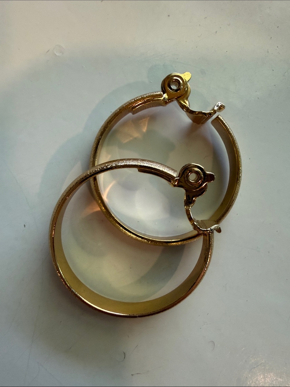 Vintage Monet Textured Gold Tone Clip On Hoop Huggie Earrings